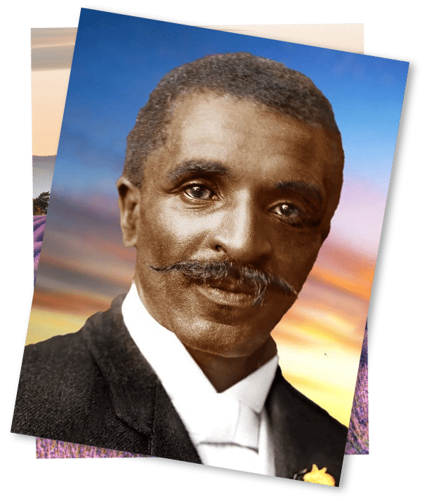 George Washington Carver wearing a suit and tie smiling at the camera