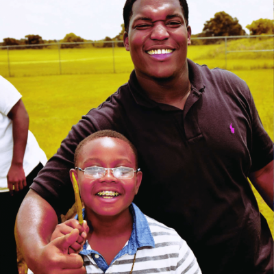 A Smiling Man And Woman Posing For A Picture